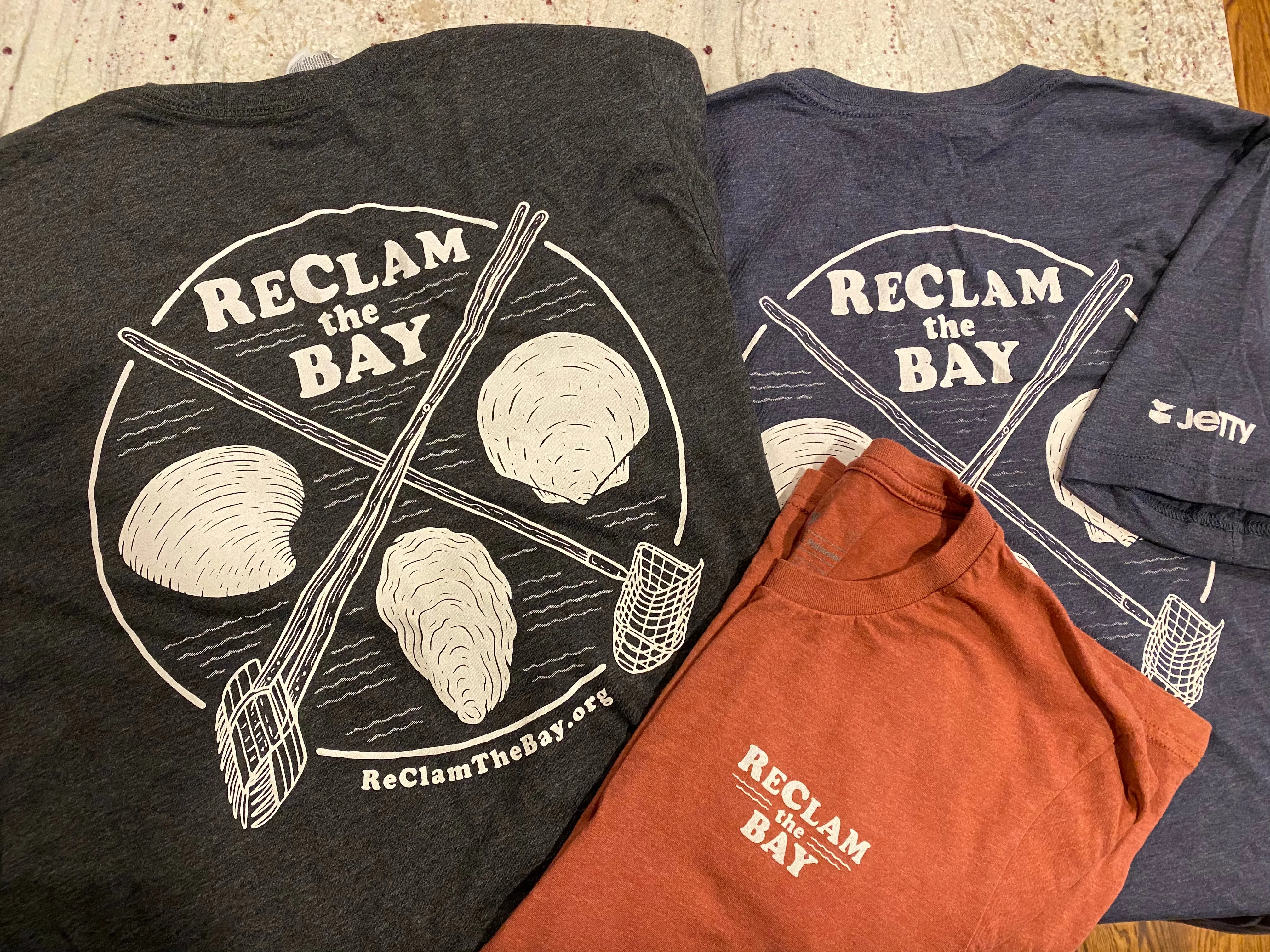 Jetty T Shirt: Shells and Rakes RCTB shirt: Clay, Charcoal, Toast, and our newest color: Light Olive